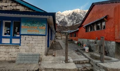 Himalayan View Hotel entrance in Bhimthang with snow-capped mountains in the background.