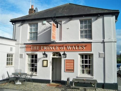 The Prince of Wales pub exterior with outdoor seating under a blue sky in Marlow.