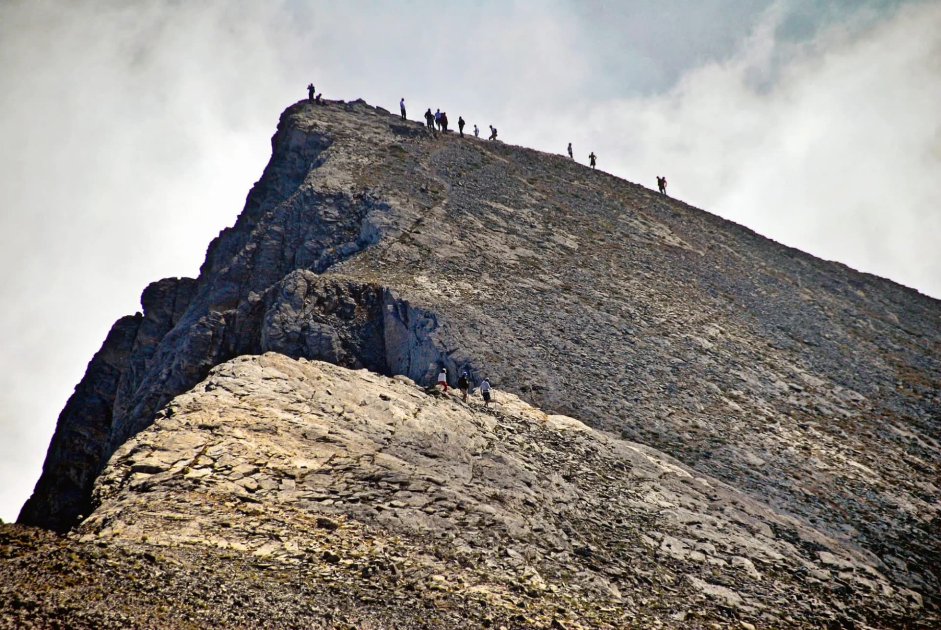 Mountain trekkers on Mount Olympus in central Greece, through the stone path, towards the Skolio summit (2.912 m.), on the way of the E4 European long ... See More
