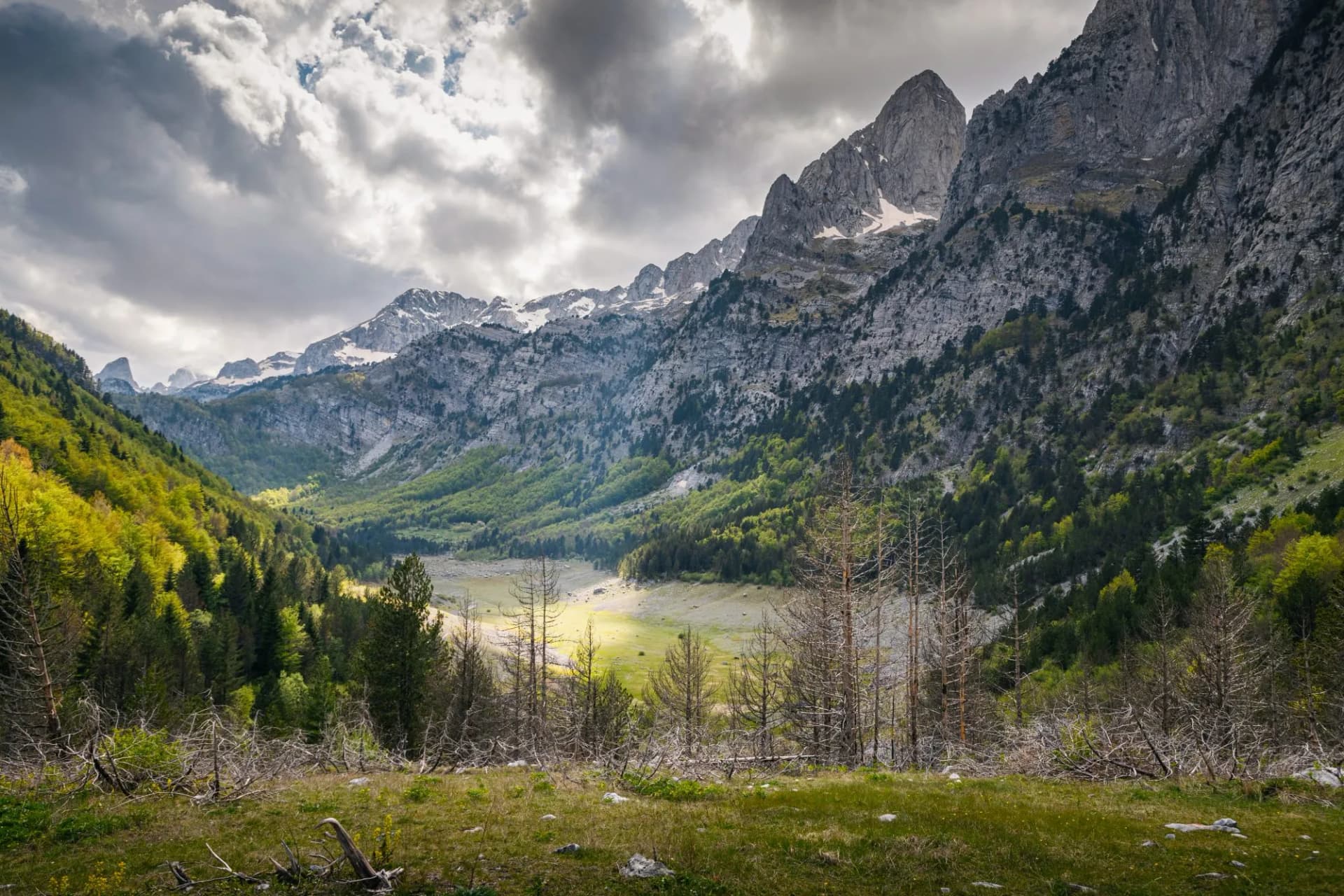 Majestic views await travelers in Montenegro's Prokletije National Park, where steep roads lead to idyllic valleys and breathtaking mountain landscapes.