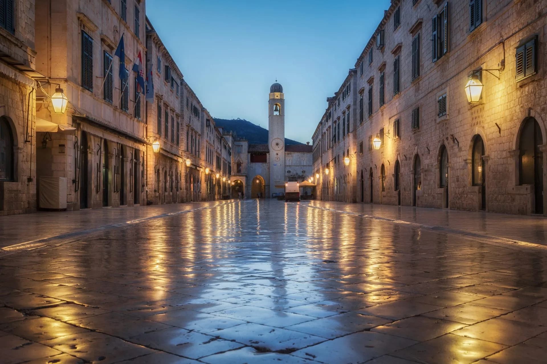 Old Town of Dubrovnik Stradun street with illuminated stone buildings at dusk