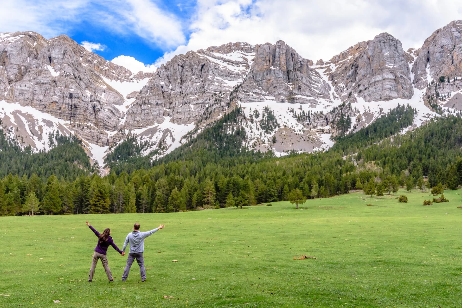 Mountain landscape with hikers having great time. (Cadi-Moixero Natural Park, Catalonia, Spain)