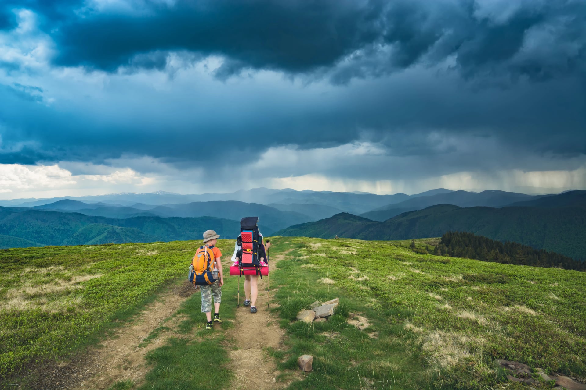 Mother with son and baby in a mountains