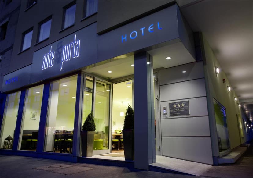 Hotel Ante Porta entrance at night with illuminated signage and three-star superior rating plaque.