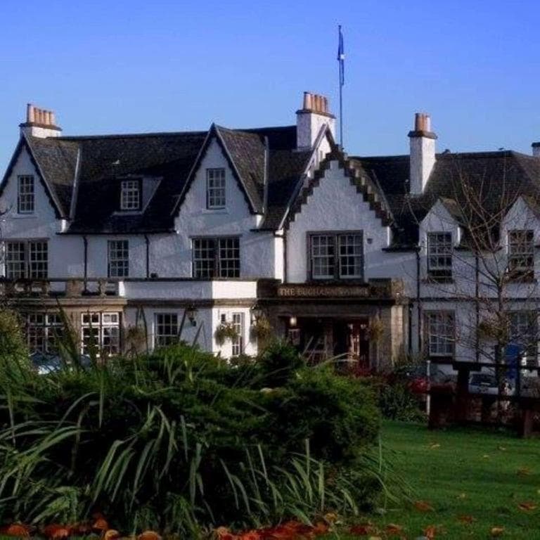 Buchanan Arms Hotel Sure Hotel Collection exterior with white walls, dark roof, and green lawn.