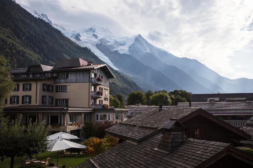 Hotel Hameau Albert 1er with snow-capped mountains in the background