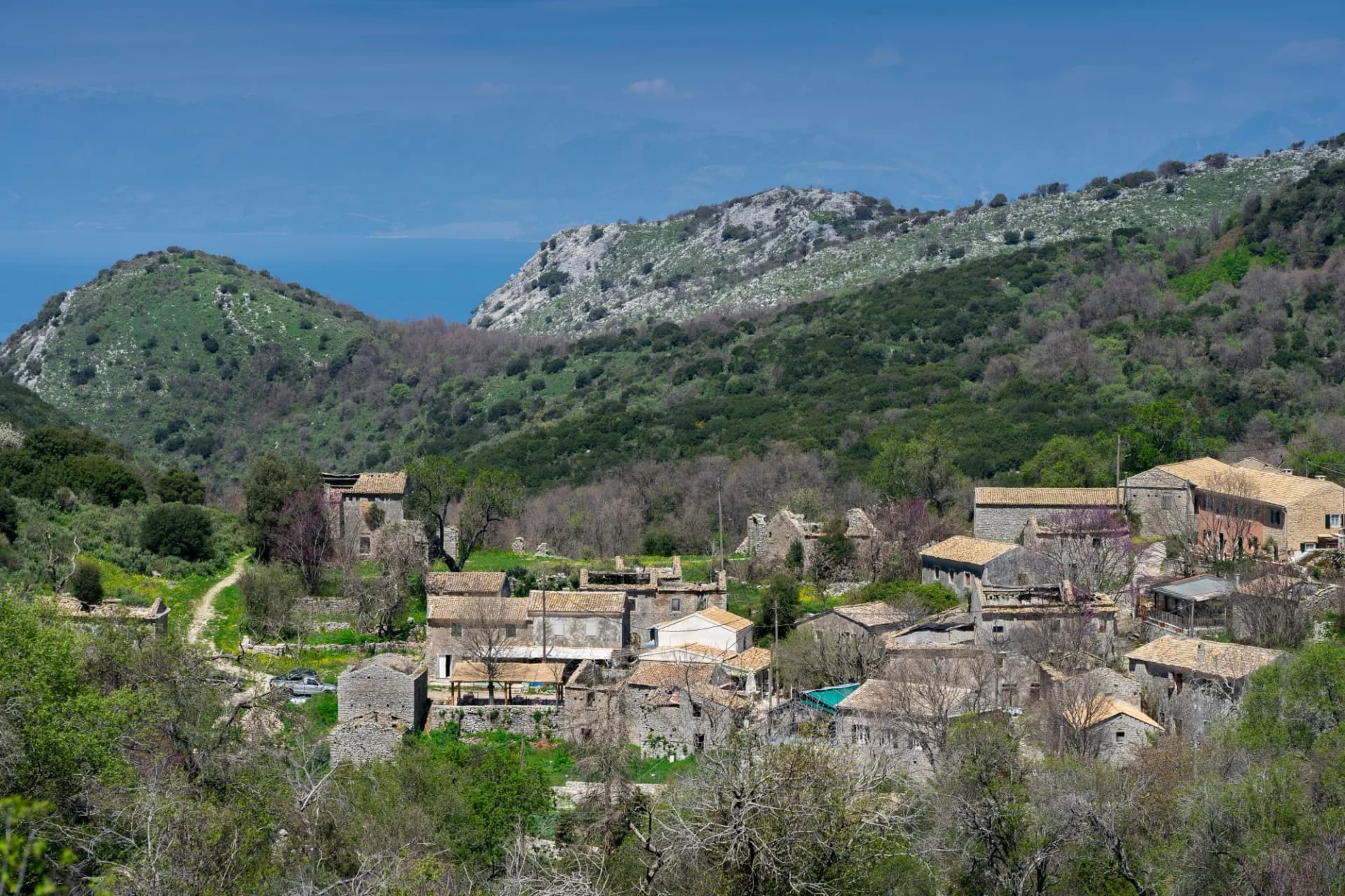 Old abandoned stone-built houses in Old Perithia at Pantokrator Mountain, Corfu. This is simply a ghost town located on the North of Corfu green island. Discover the history of greek empire (Greece)