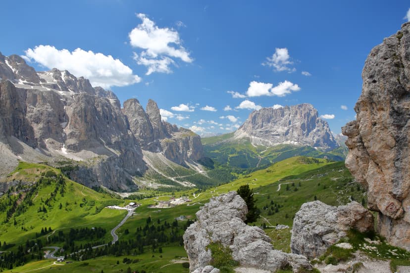 Sella Group mountains (on the left) and Sassolungo mountain (on the right) viewed from a hiking path in Puez Odle Natural Park, Val Gardena, Dolomites, Italy
