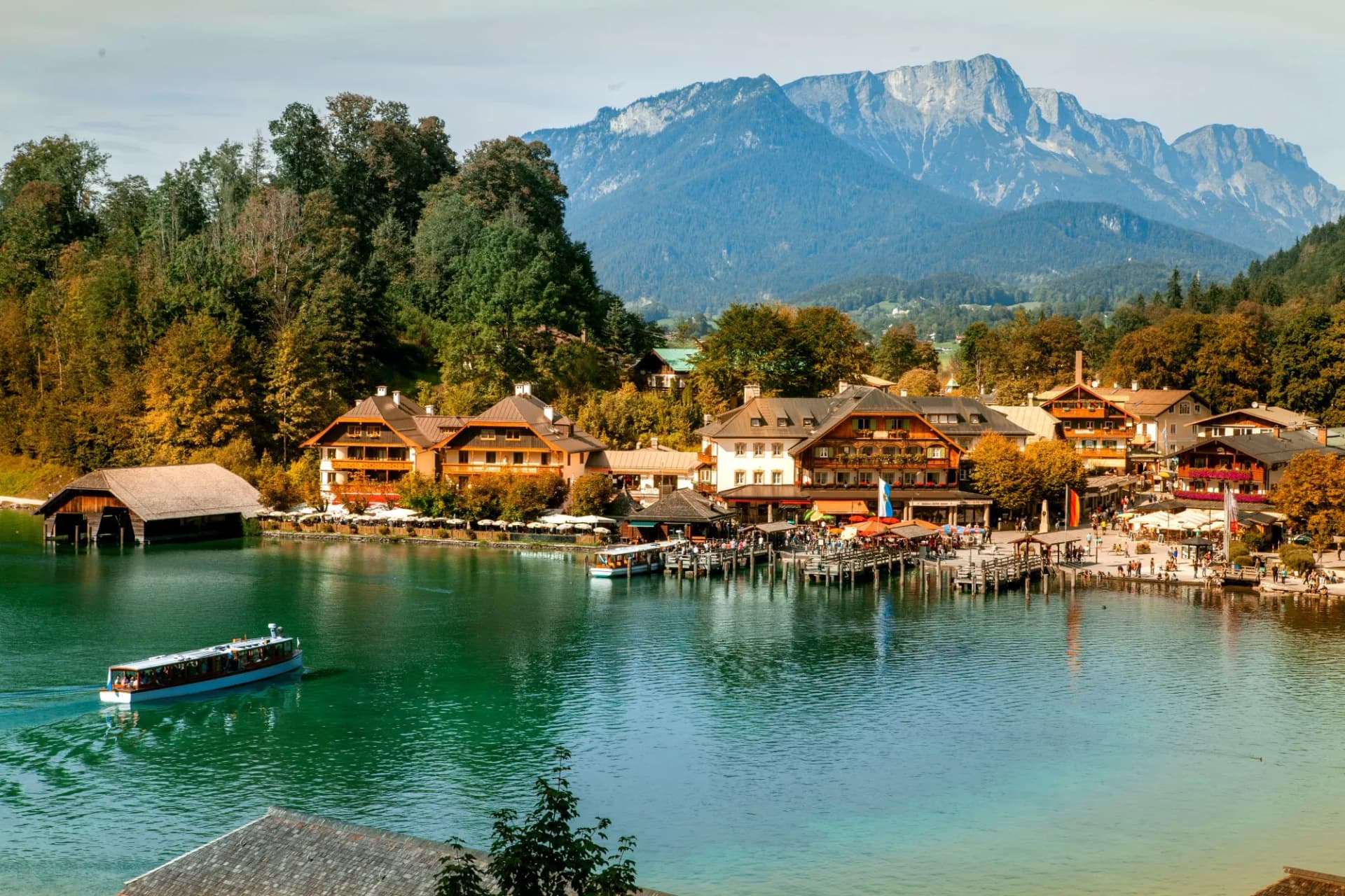 Schönau am Königssee, Germany - September 9, 2018: Electric tourist boats on beautiful lake Konigssee pier Berchtesgaden National Park Bavaria Germany