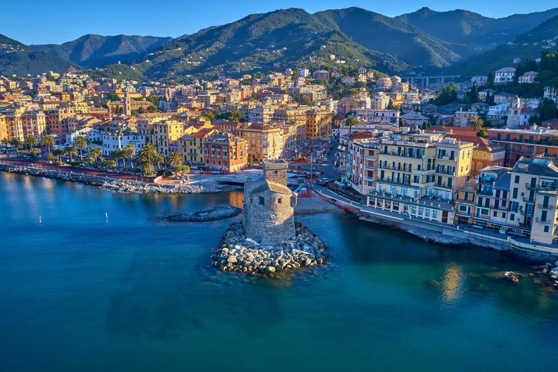 Panoramic aerial view of the bay of the tourist city of Rapallo, Genoa, Italy. Boat parking, resorts in Italy. Aerial photography with drone.