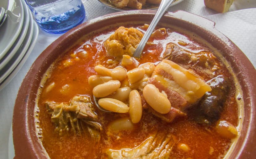 Fabada asturiana served in a traditional clay cazuela