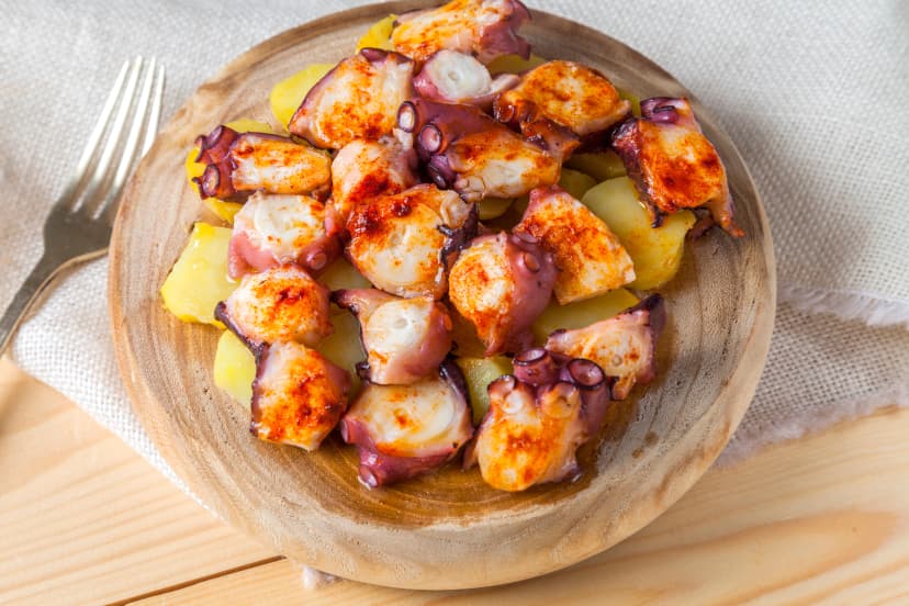 Spanish tapas Pulpo a la Gallega,typical spanish octopus with potato,olive oil and paprika
