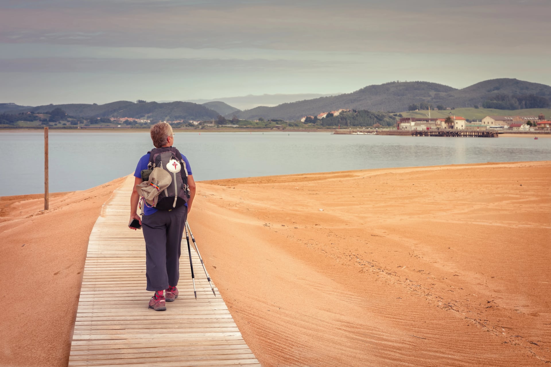 Pilgrim walking to catch the ship that transports you to Santoña (Cantabria),Spain