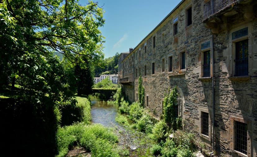 View of the landmark monastery of Samos alongside Sarria river in the Galicia region of Spain, right on Saint James way.