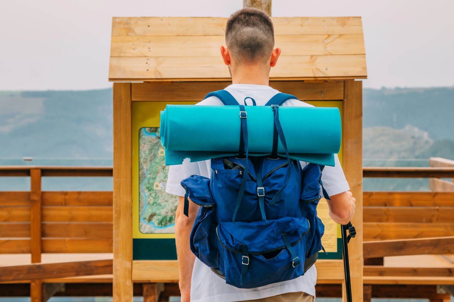 traveler with backpack looking at the map