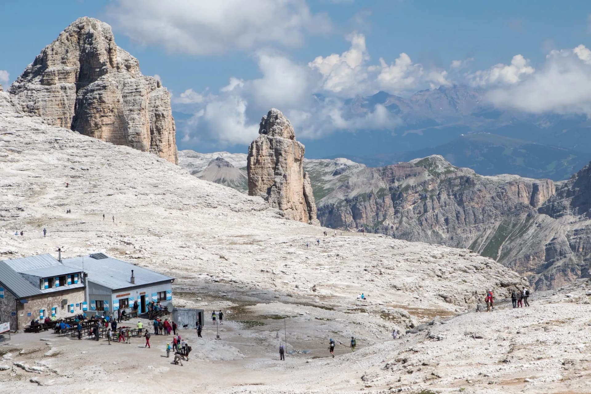 August 28, 2019: top view of Rifugio Boé with hikers in the summer season, Italian Dolomites