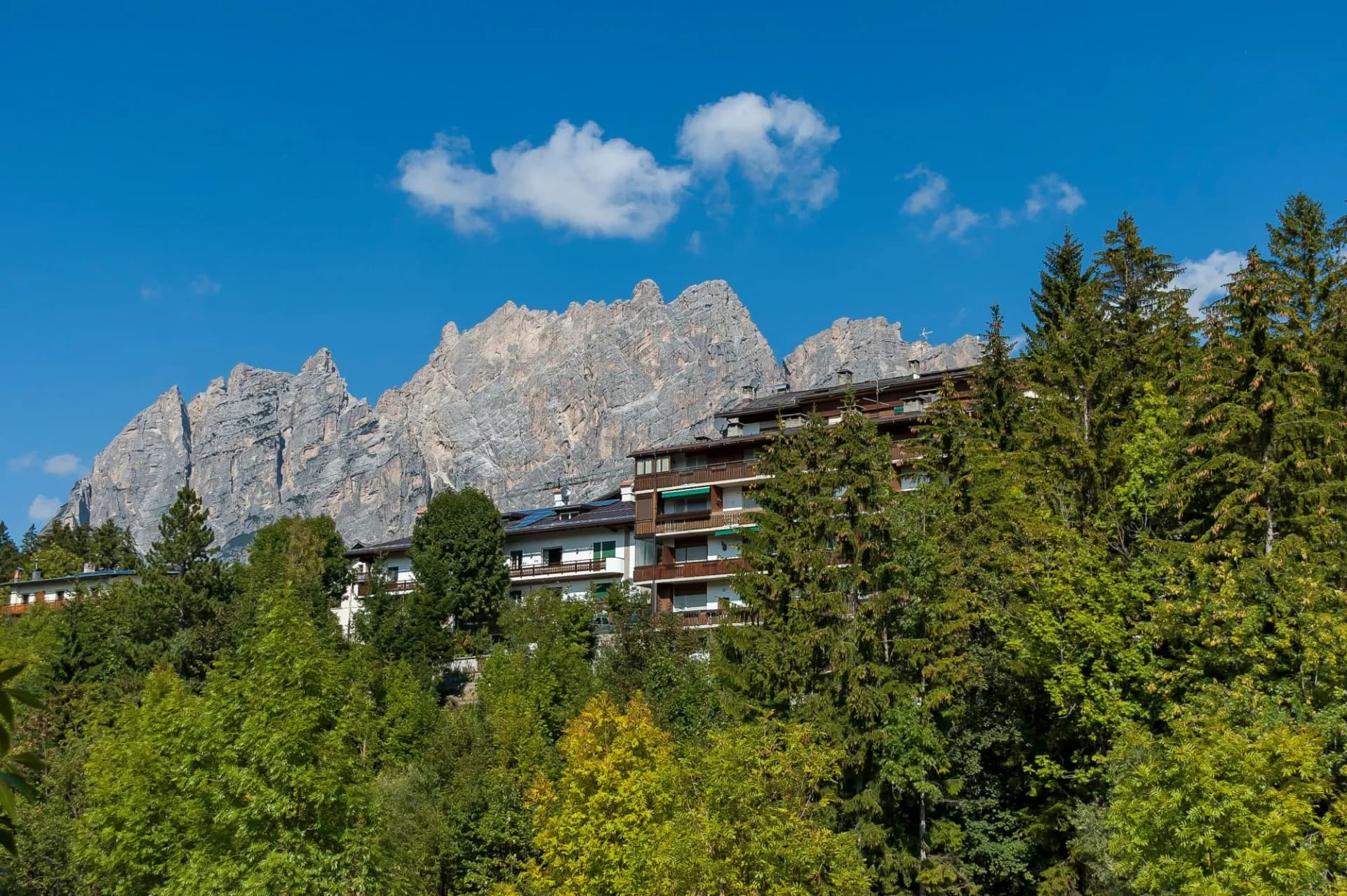 Autumnal corso Italia, the residential district in the town Cortina d'Ampezzo with mountain, Dolomite, Alps, Veneto, Italy, Europe