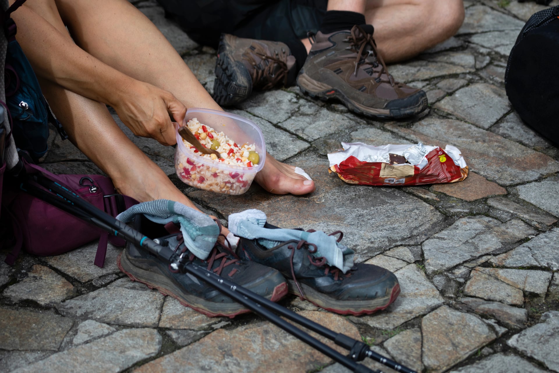 Pilgrims from the Camino de Santiago arrive at the Plaza del Obradoiro because they have finished their pilgrimage