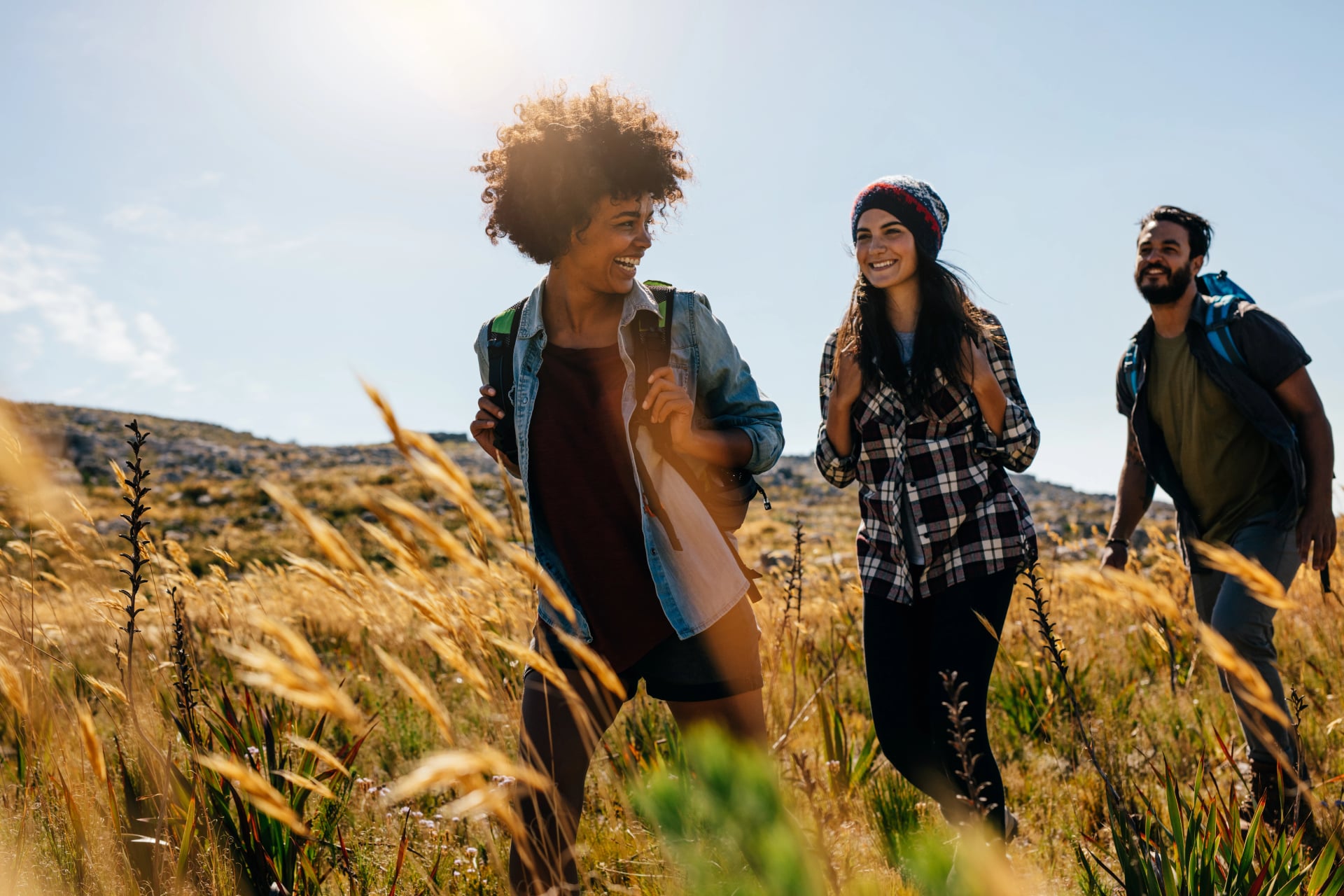 Happy group of friends hiking together