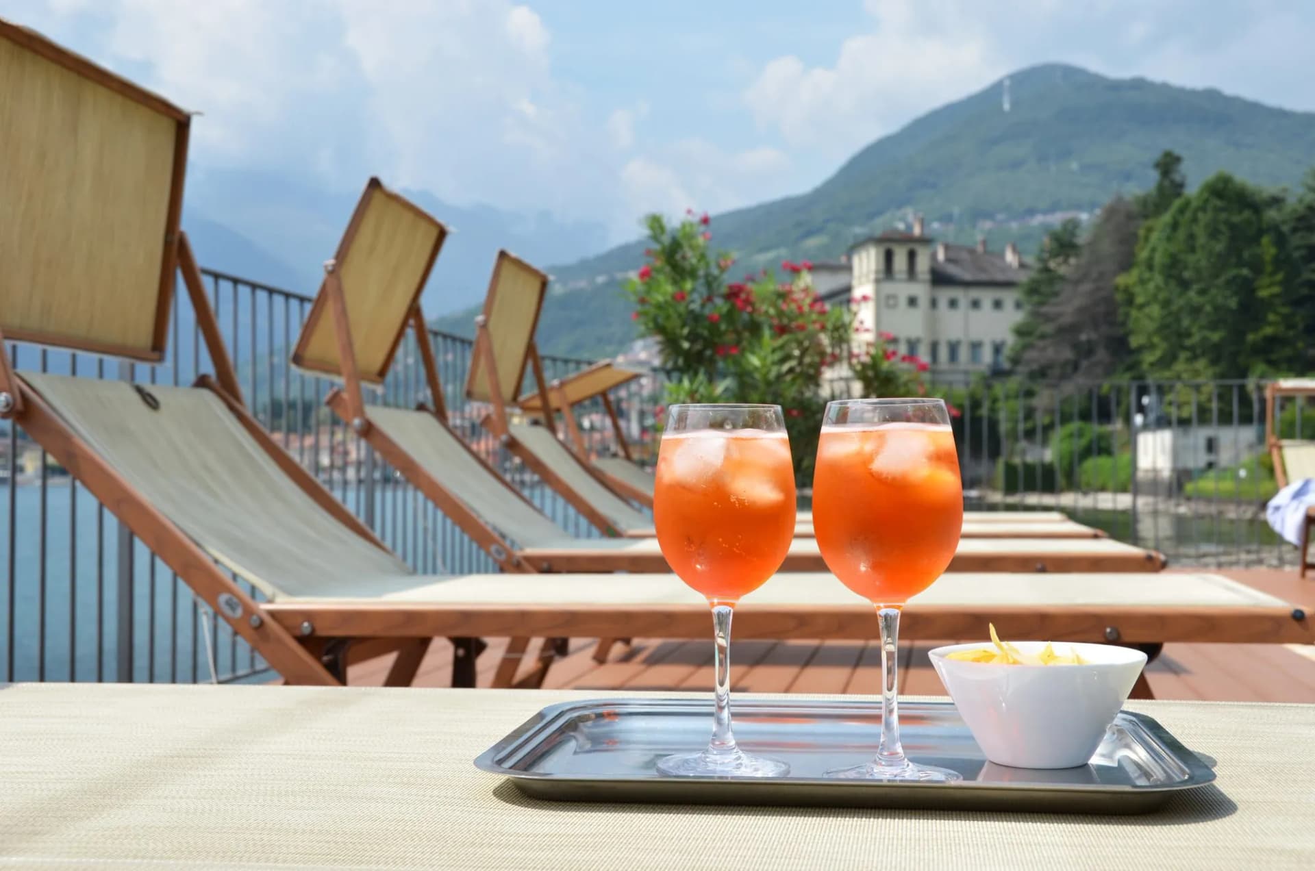 Traditional Italian Spritz cocktail against lake Como, Italy