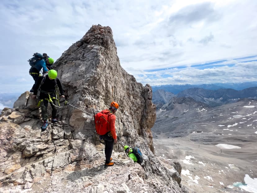 Hiker to Zugspitze by using the via ferrata hike trail path