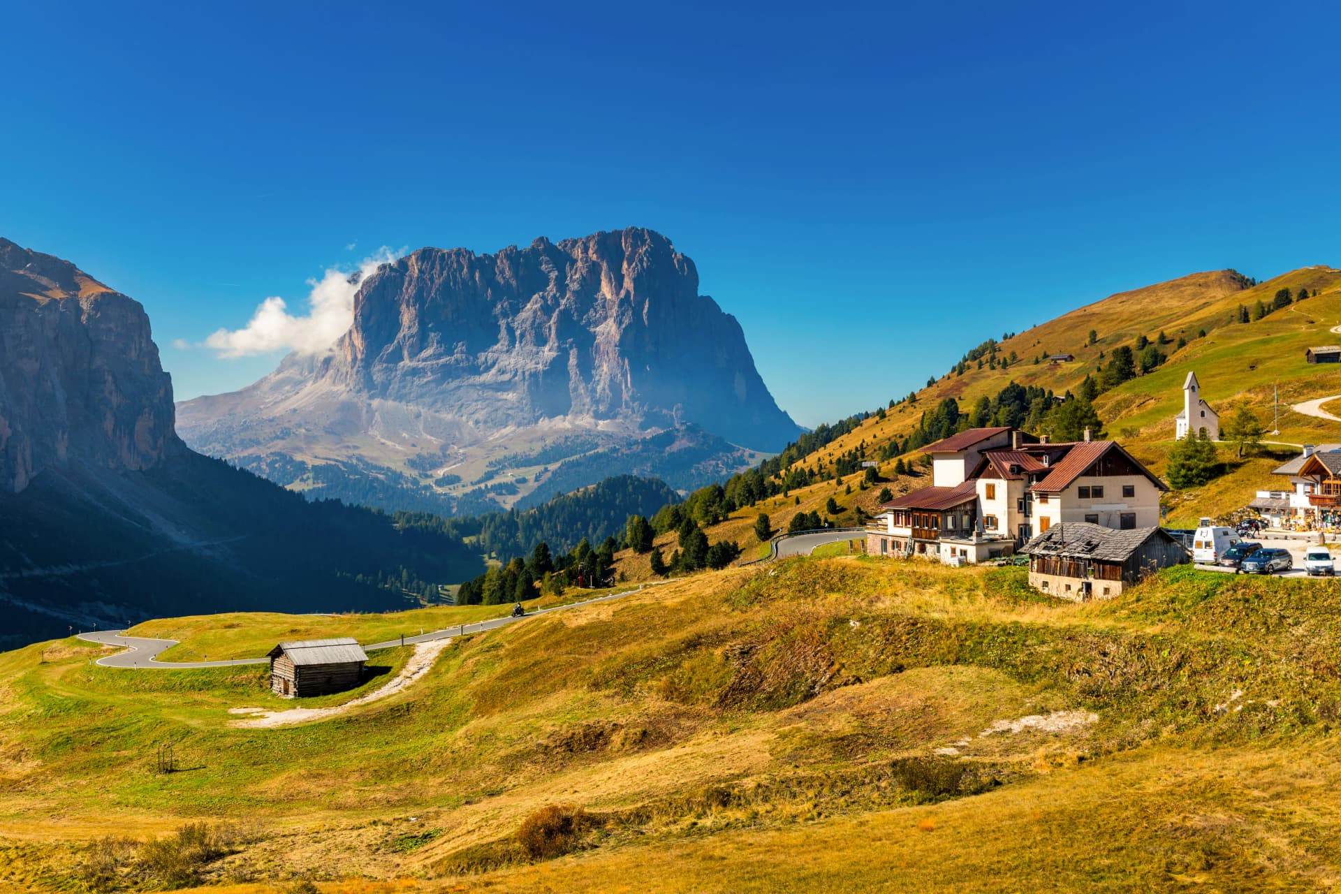 Gardena Pass, Trentino Alto Adige, Italy. Gardena Pass with Sassolungo mountain on the background. Passo Gardena, alpine pass between Val Badia and Val Gardena, South Tyrol, Italy.