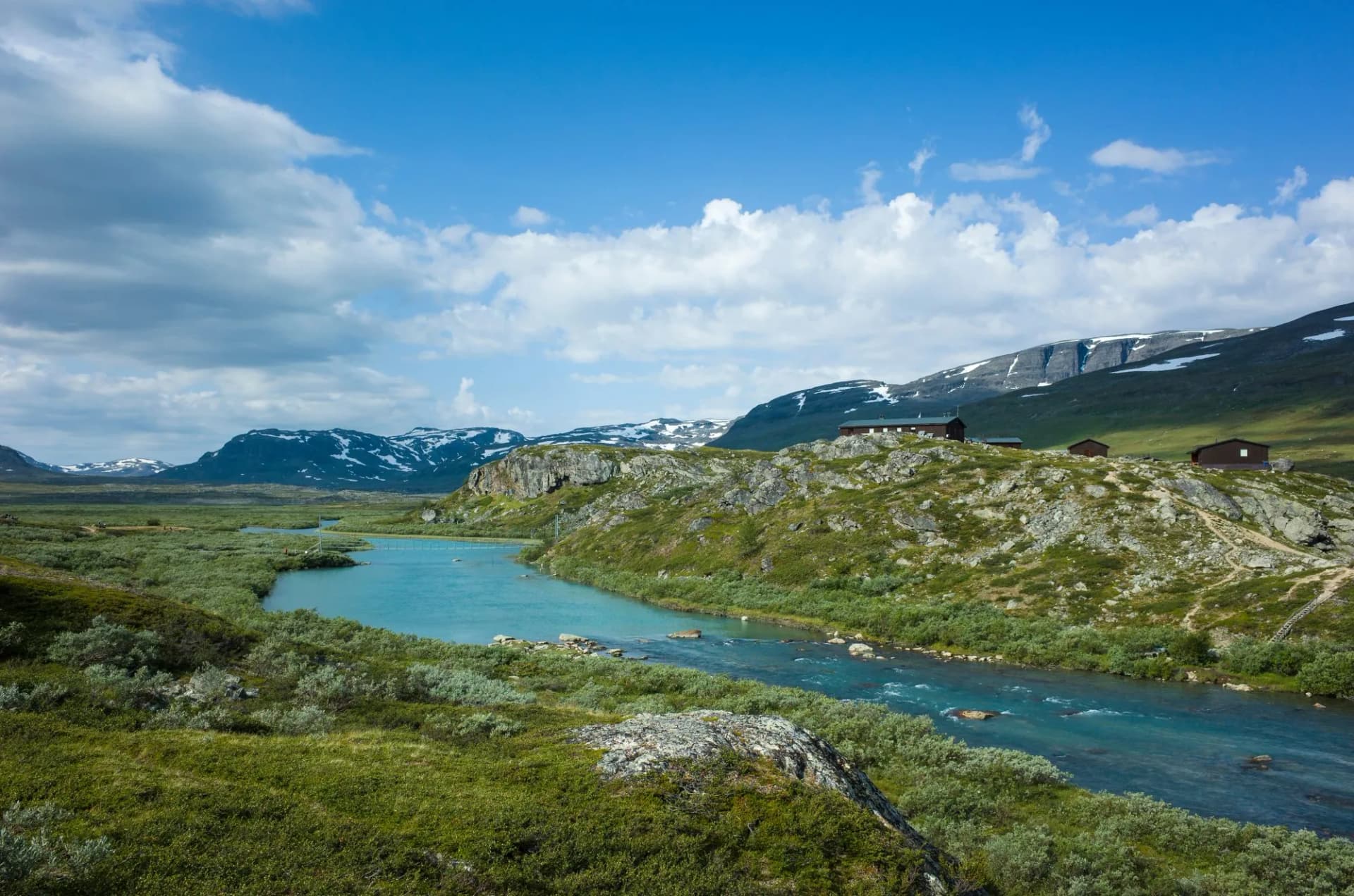 Swedish Lapland landscape. Arctic environment of Scandinavia in summer sunny day. Alesjaure mountain cabins on Kungsleden and Nordkalottruta Arctic hiking Trail in northern Sweden