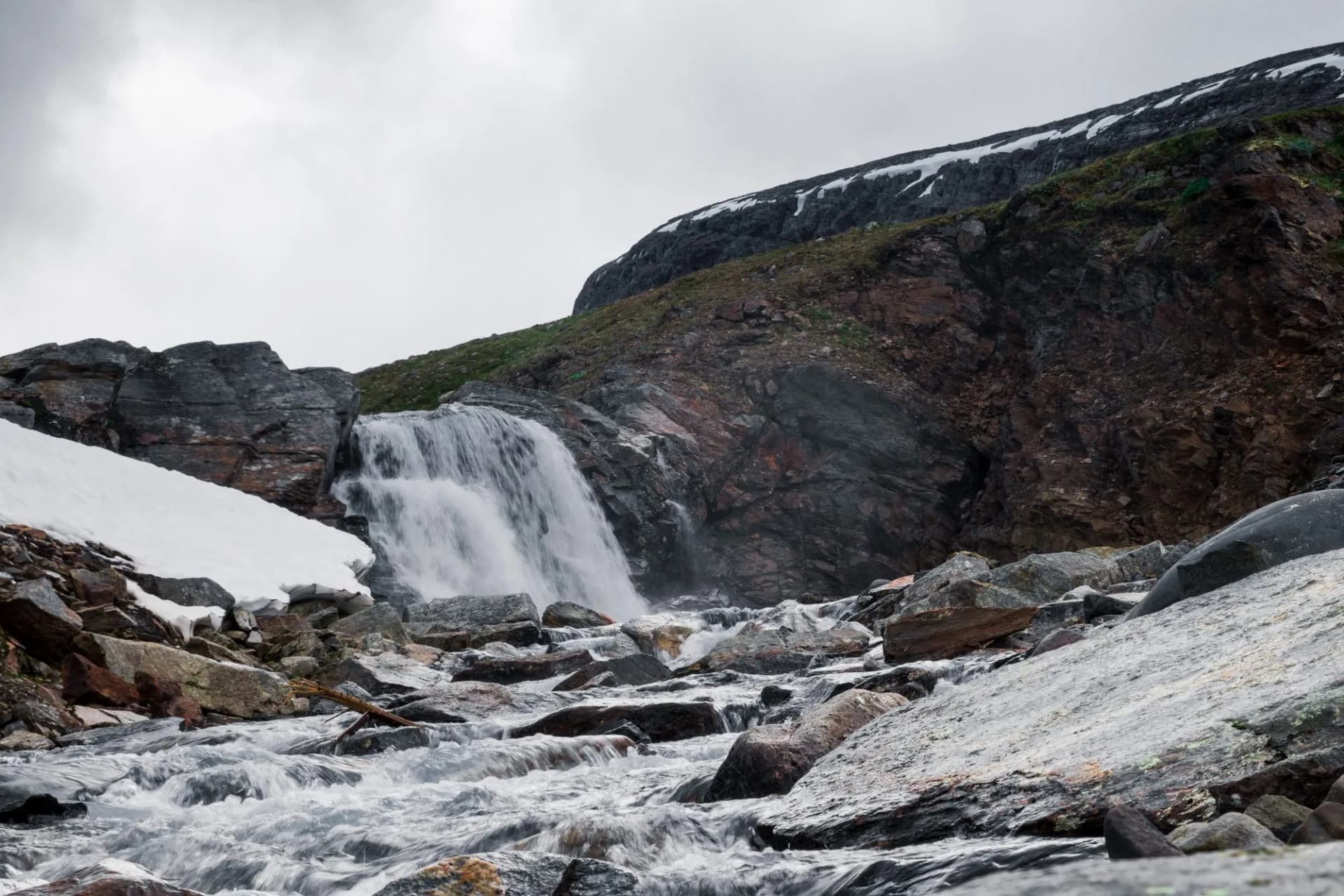 Waterfall and snow at the "Tjäktja" cabin along the Kungsleden (Kings path) hike in northern Sweden.