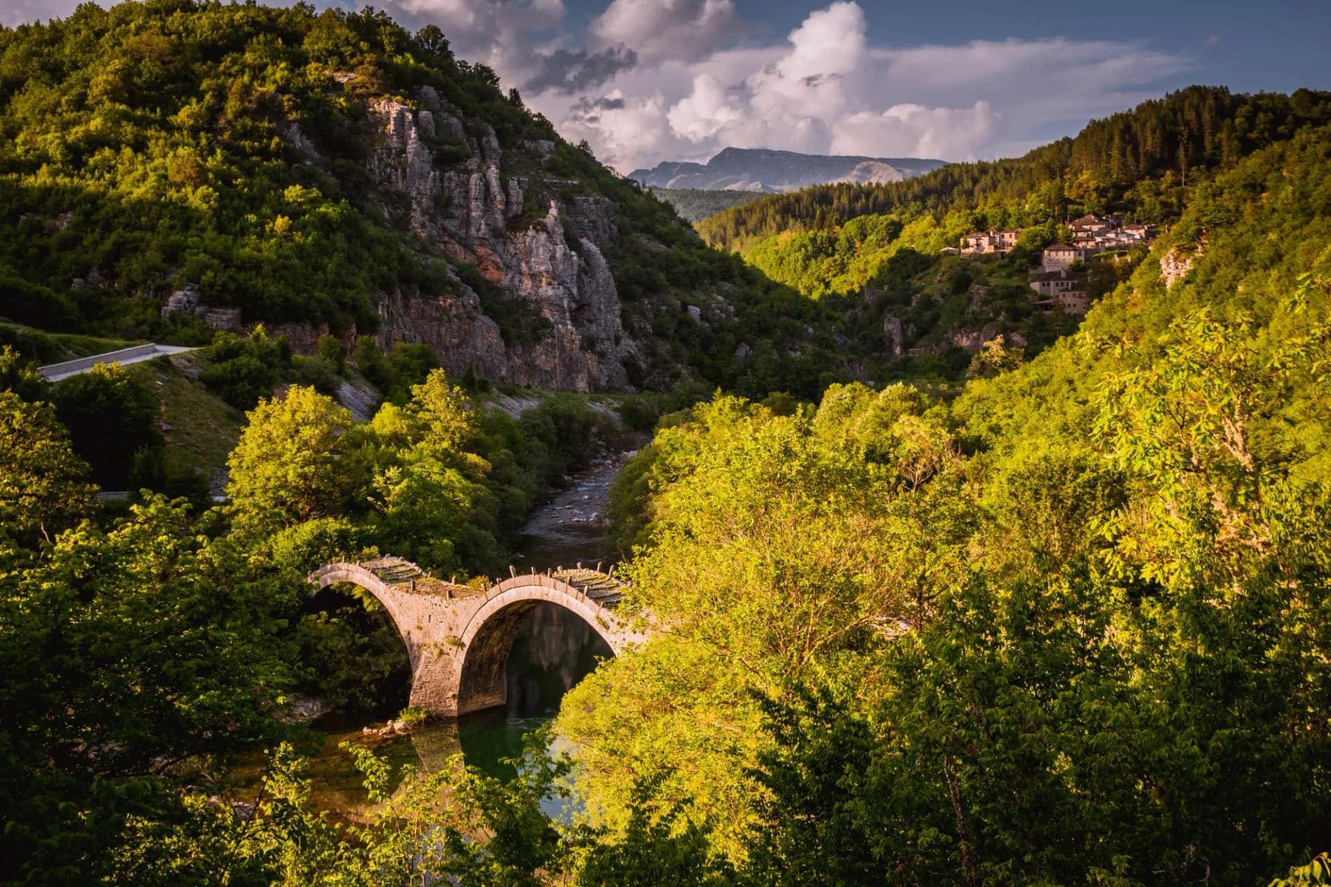 Plakidas Bridge with Kipi village on background.
Arches stone bridge of Kalogeriko on the river of Voidomatis. Central Zagoria, Epirus, Greece