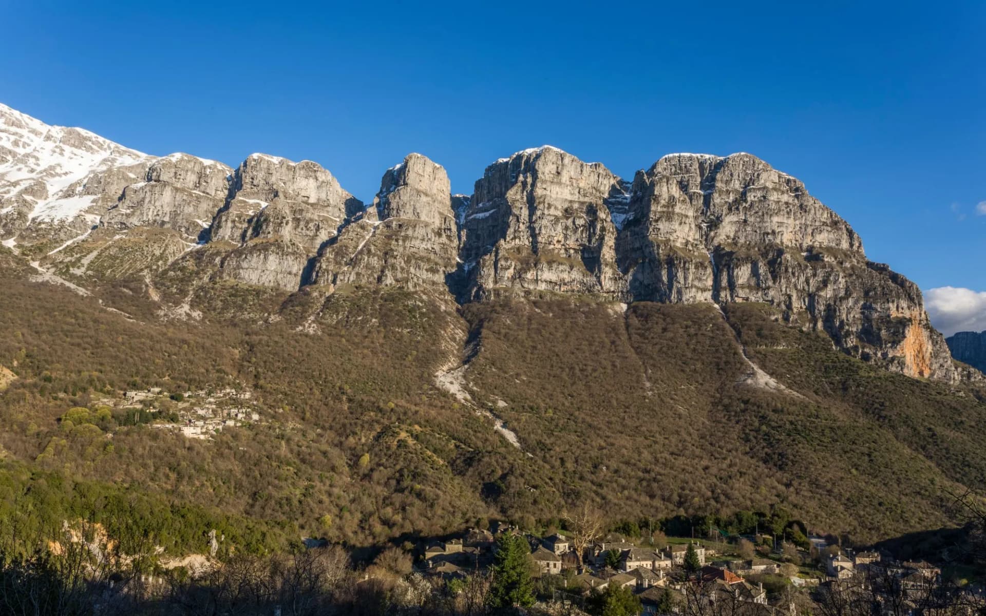 Natural towers of Astraka, mount Timfi and Papingo village in central Zagori