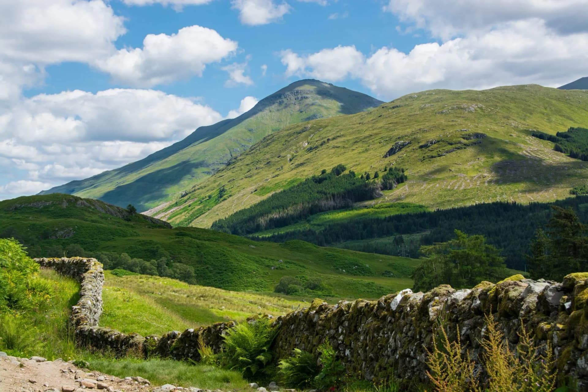 Along the West highland Way in Scotland. An old stone wall runs along the hiking path in the Glen Falloch valley