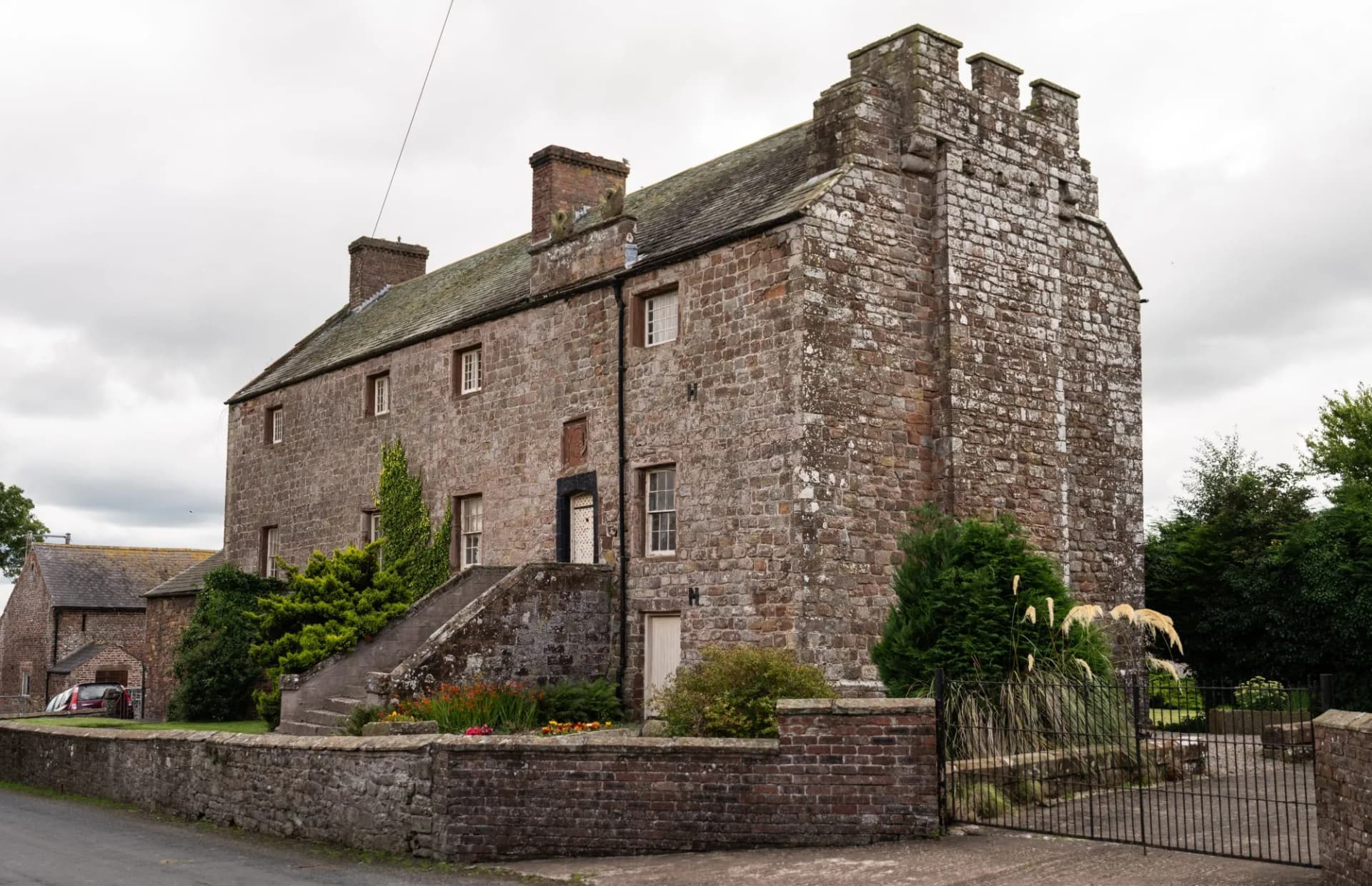 looking across to Drumburgh Castle along Hadrian's Wall Path, Bowness-on-Solway, Cumbria, UK