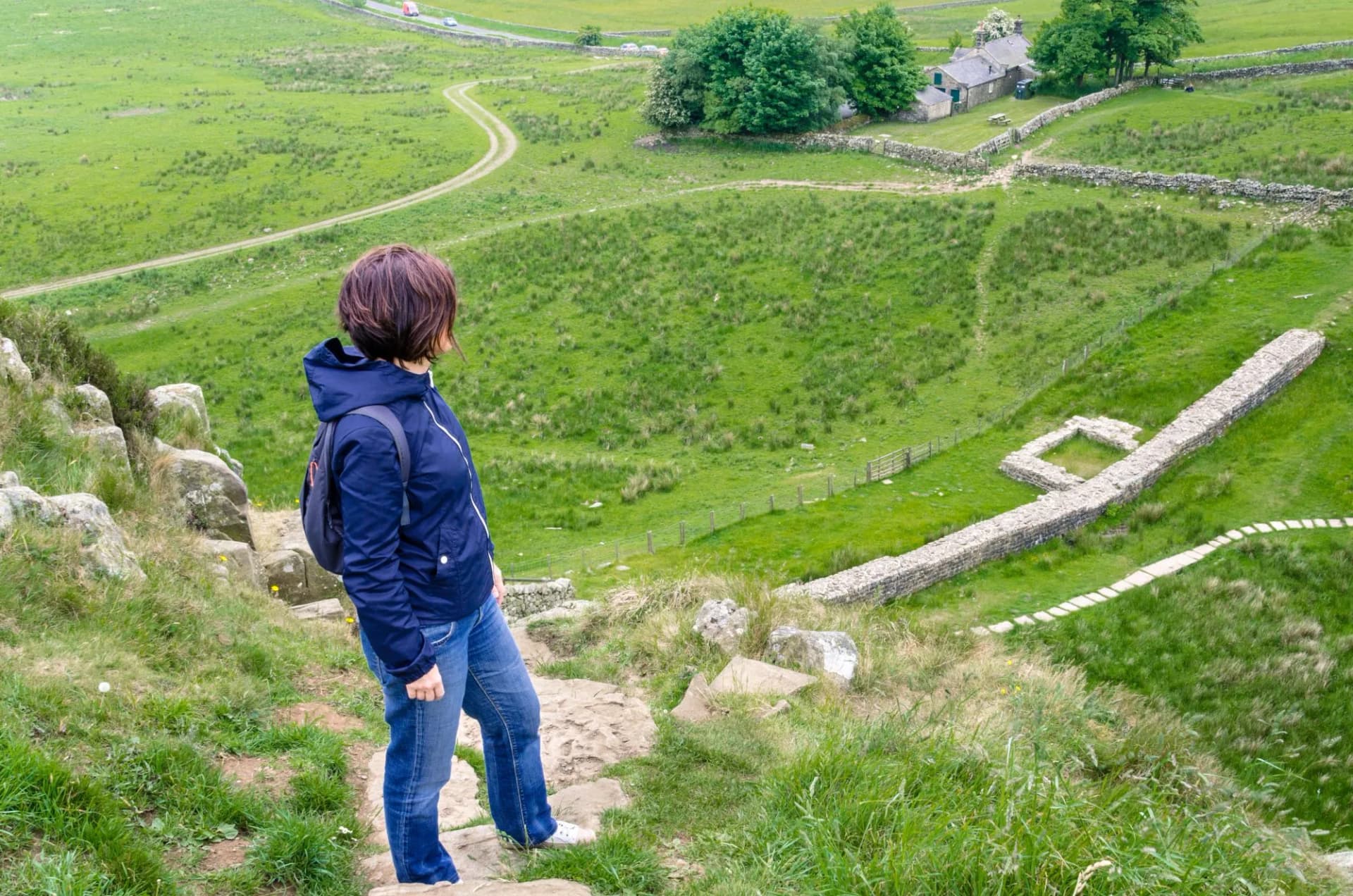 Woman Hiker on a Mountain Path admiring the Scenery