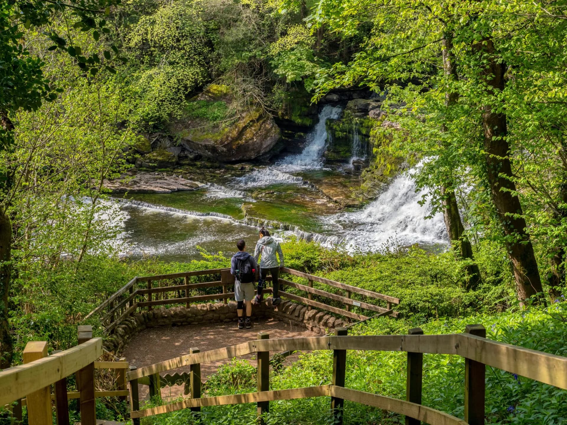 Aysgarth Falls, North Yorkshire - Young couple on the viewing platform at Middle Force, Aysgarth Falls.