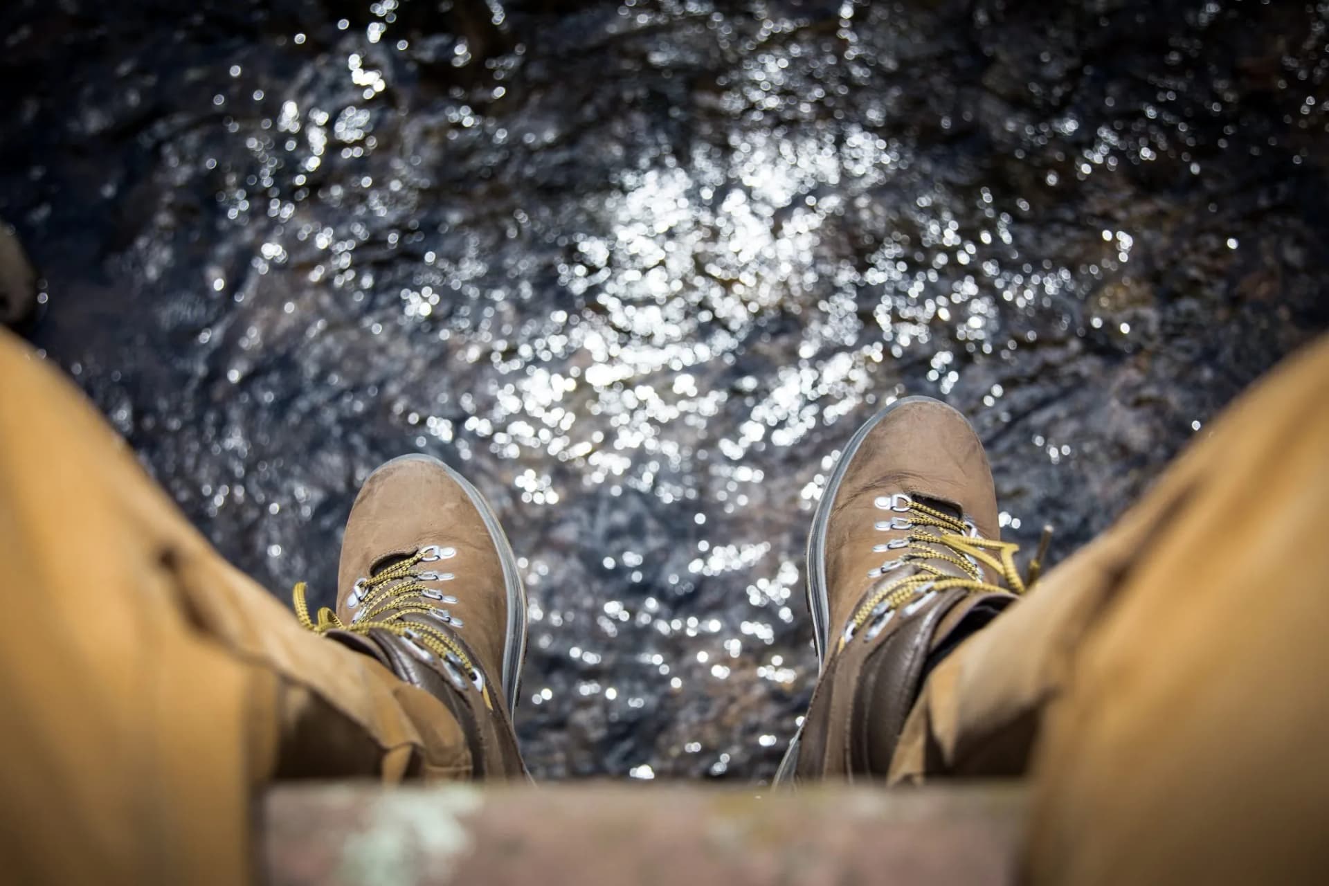 hiking shoes above a river