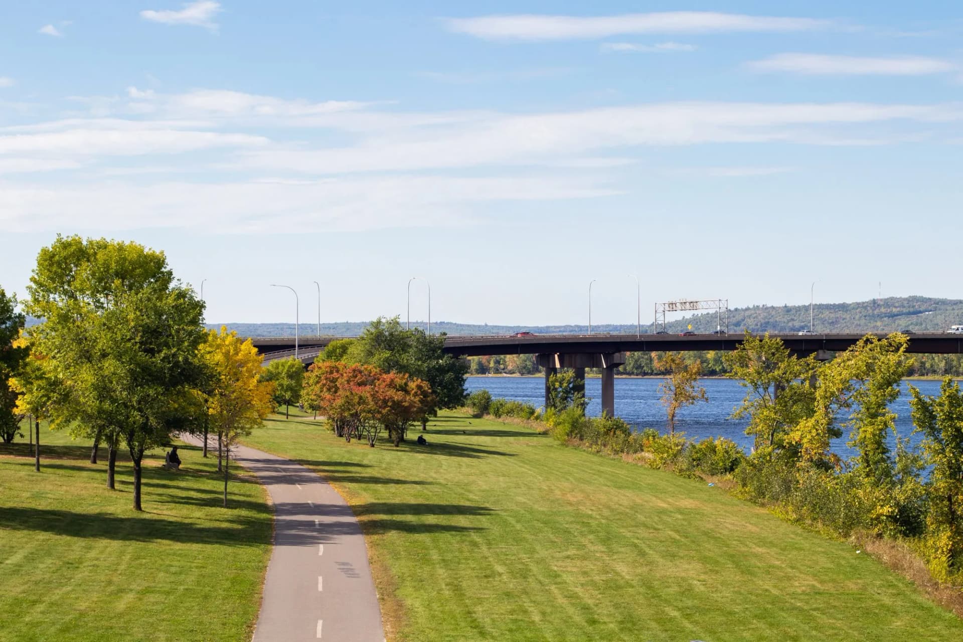 Westmorland Bridge and Saint John River walking trail in Fredericton, NB Canada.