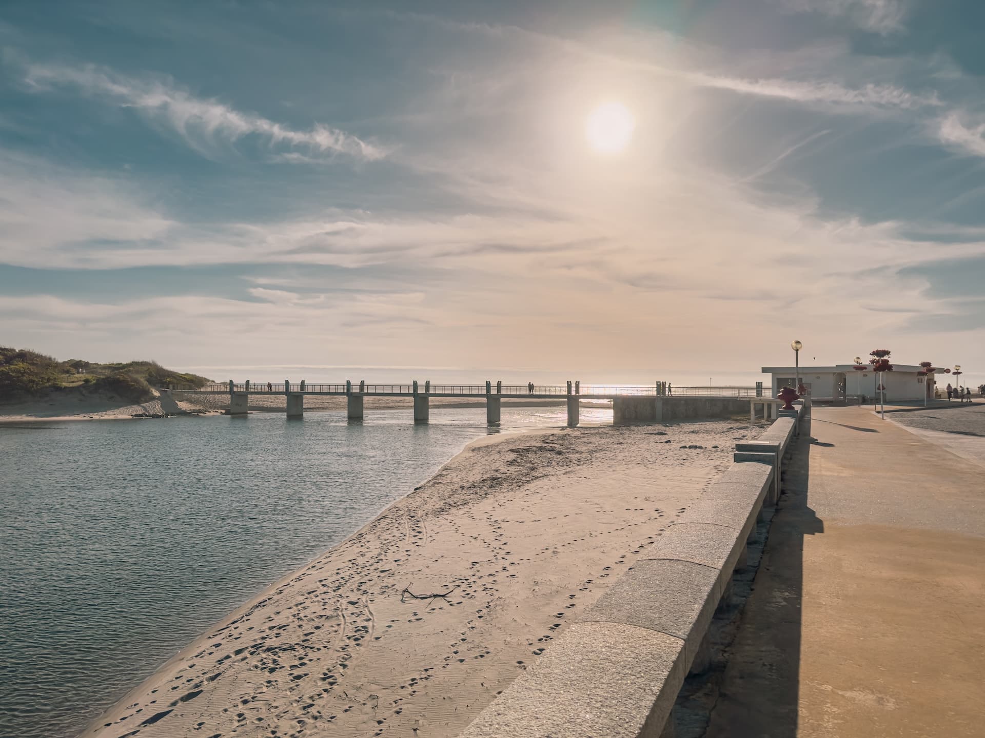 Âncora river meets the sea via a pedestrian bridge in Vila Praia de Âncora, Portugal.