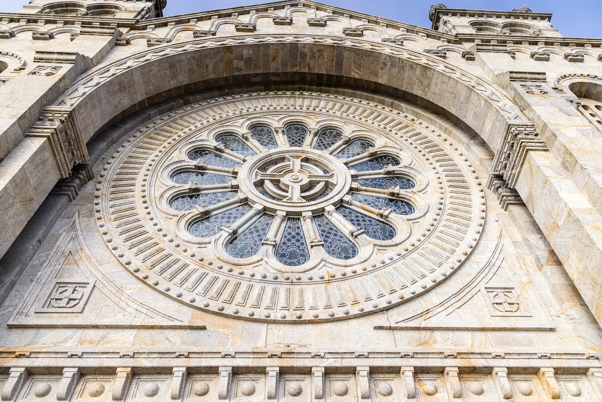 Rose window detail on the stone facade of the Sanctuary of the Sacred Heart on the Monte de Luzia.