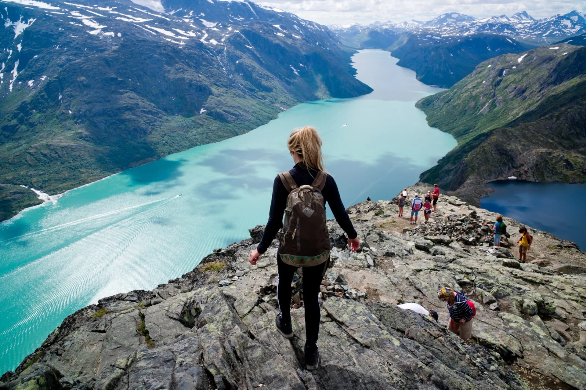 Blond, young woman hiking Besseggen, Jotunheimen,