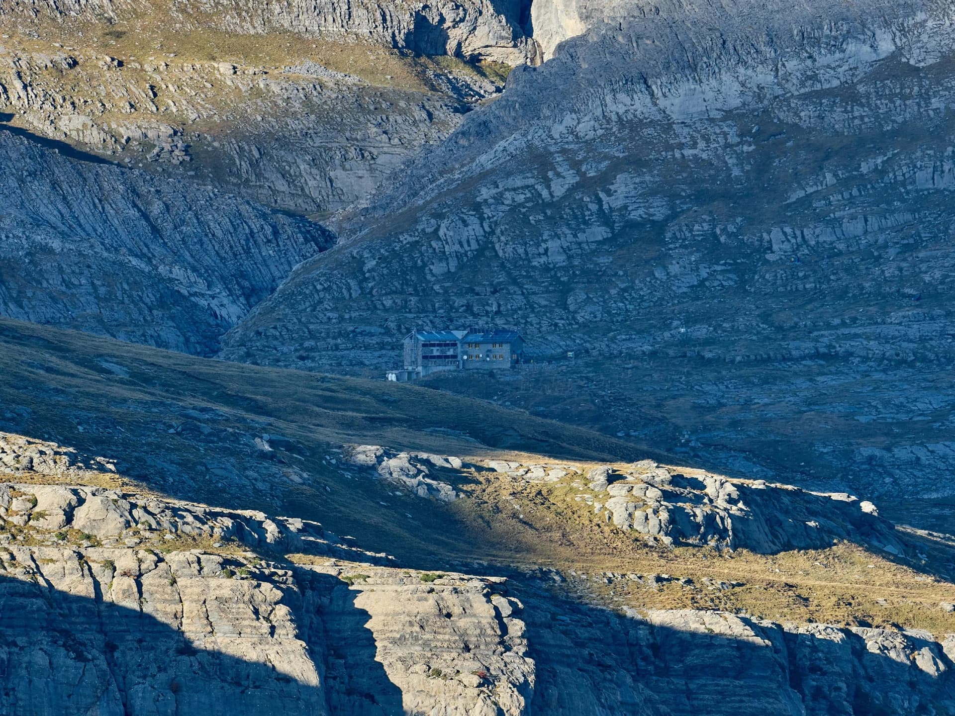 Góriz shelter, at the base of the lost mountain, at 2200 meters of altitude, photographed from the "cola de caballo" viewpoint, Aragonese Pyrenees, Spain